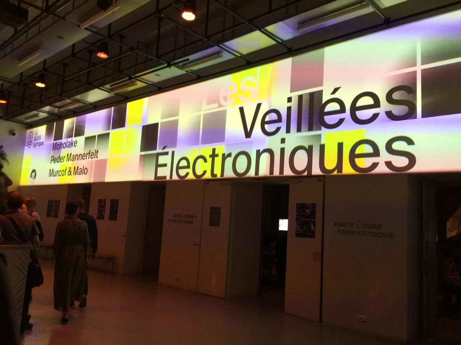 The lit sign of the Veillees Electroniques night at the Gaite Lyrique, Paris, over the entrance hall.