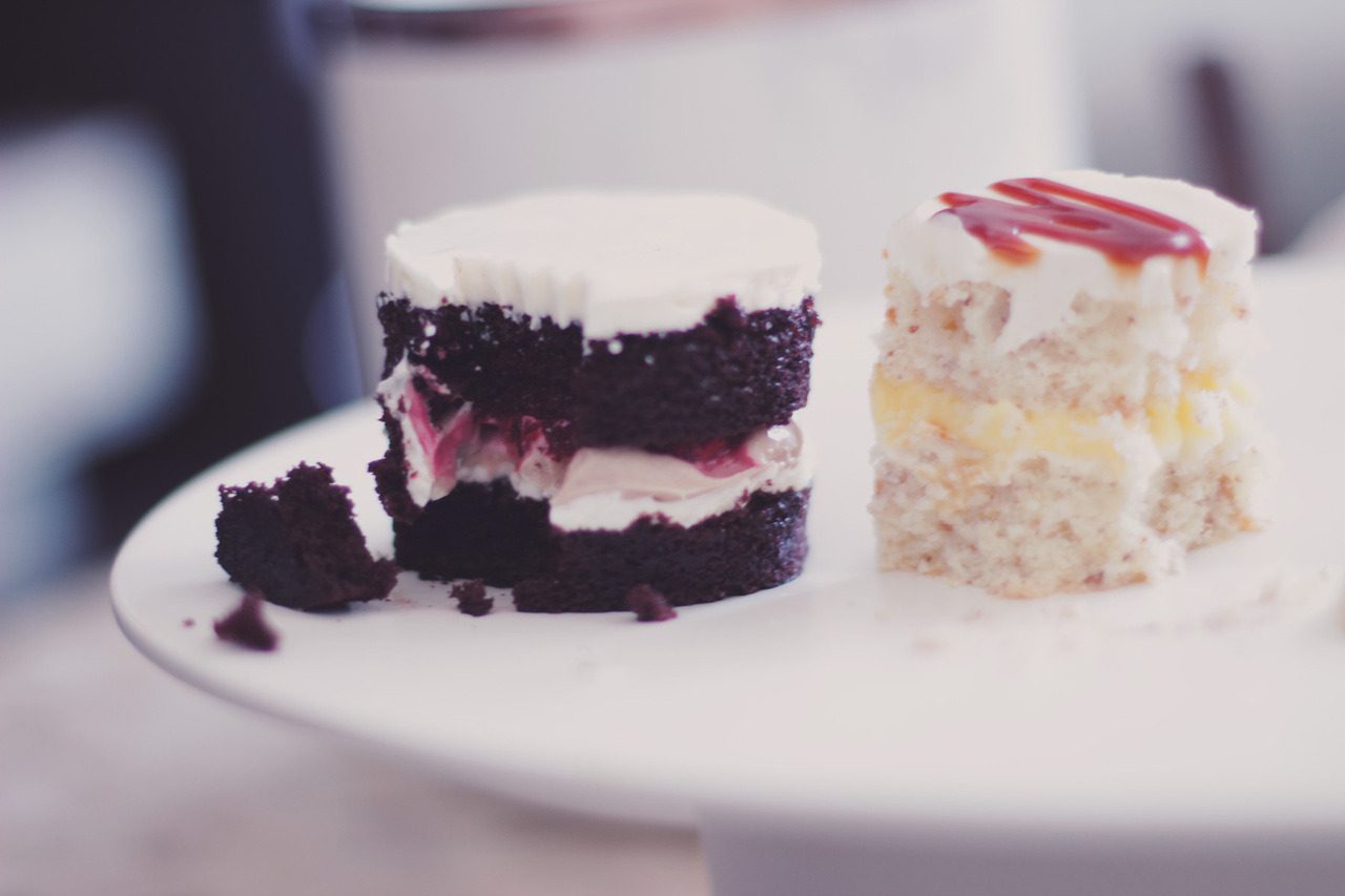 Two tasting slices side by side on a white plate.